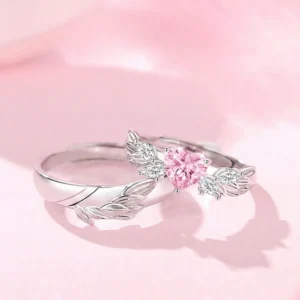 AMOR CELESTIAL: ANILLOS DE PAREJA EN PLATA 925 CON ALAS DE ÁNGEL Y CORAZóN ROSA